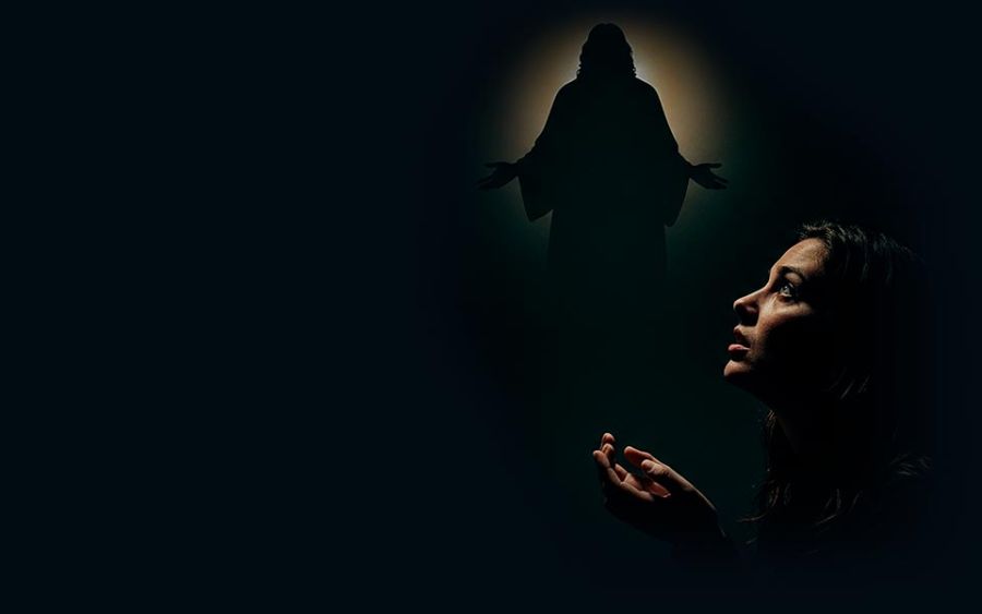 Woman in her room praying